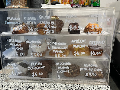 Nola Coffee's acrylic pastry cabinet with handwritten menu labels